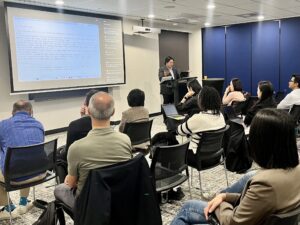 Tim Heng presenting at the Sydney hybrid meetup